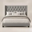 Bellmere Wingback Bed in grey upholstery with diamond-tufted headboard and nailhead trim, front view.
