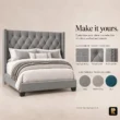 Angled view of Bellmere Wingback Bed in grey upholstery with diamond-tufted headboard and nailhead trim.