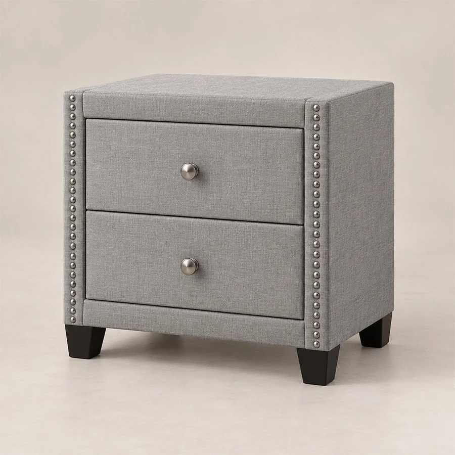 Bellmere Wingback Bedside Table in grey upholstery with two drawers and silver nailhead trim.