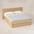 Angled top view of Caldrin Fluted Storage Bed in Natural Sheesham finish with fluted headboard and built-in storage base.