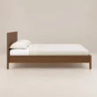 Side view of Kelden Linea Bed in Walnut Brown finish with clean panel headboard and slim wooden frame.