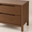 Close-up of Kelden Linea bedside table in Walnut Brown finish showing recessed drawer handles and wood grain detail.