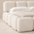 Close-up of Mirelle Upholstered Bed in ivory boucle fabric.