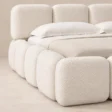 Close-up of Mirelle Upholstered Bed in ivory boucle fabric.