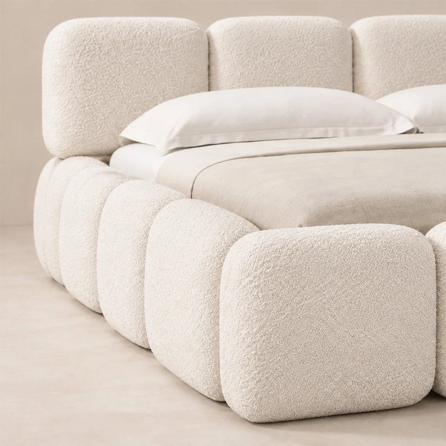 Mirelle Bed zoom in Close-up of Mirelle Upholstered Bed in ivory boucle fabric.