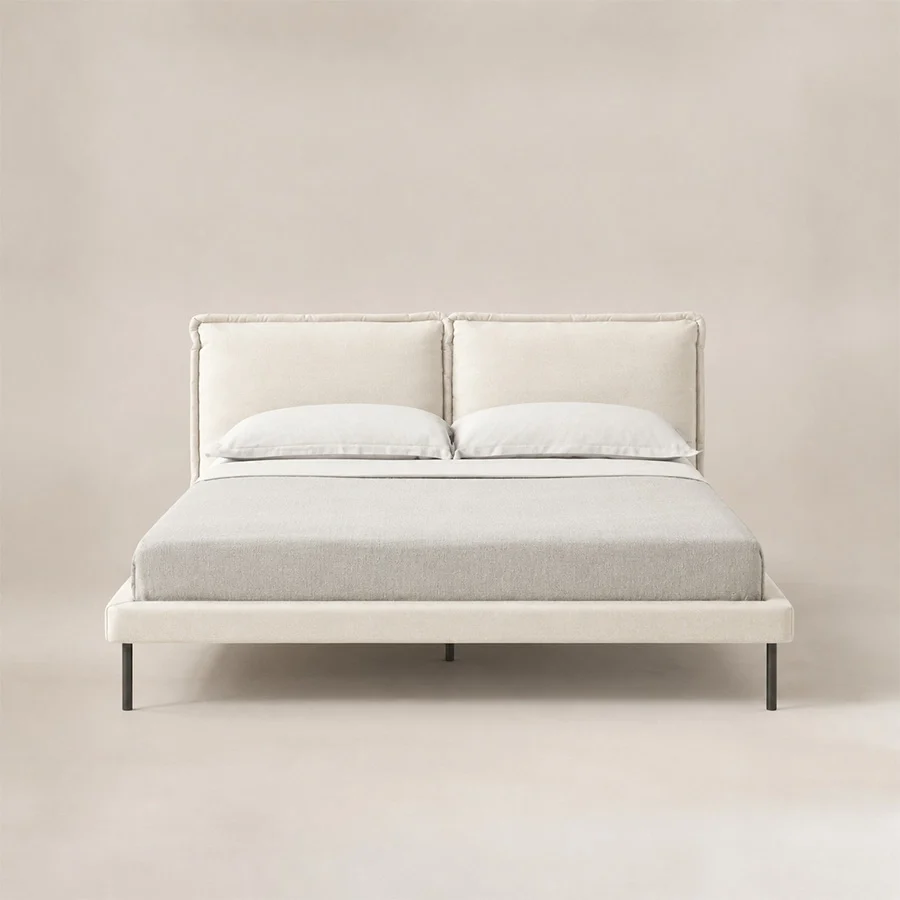 Nolven Softline upholstered Off-White bed Front view of Nolven Softline Upholstered Bed in warm ivory fabric with a soft padded headboard and slim metal legs.
