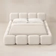 Front view of Mirelle Upholstered Bed in off-white boucle fabric.