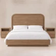 Front view of Soreven Archline Bed Set in Warm Walnut finish with arched panel headboard and matching bedside tables.