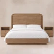 Front view of Soreven Archline Bed Set in Warm Walnut finish with arched panel headboard and matching bedside tables.