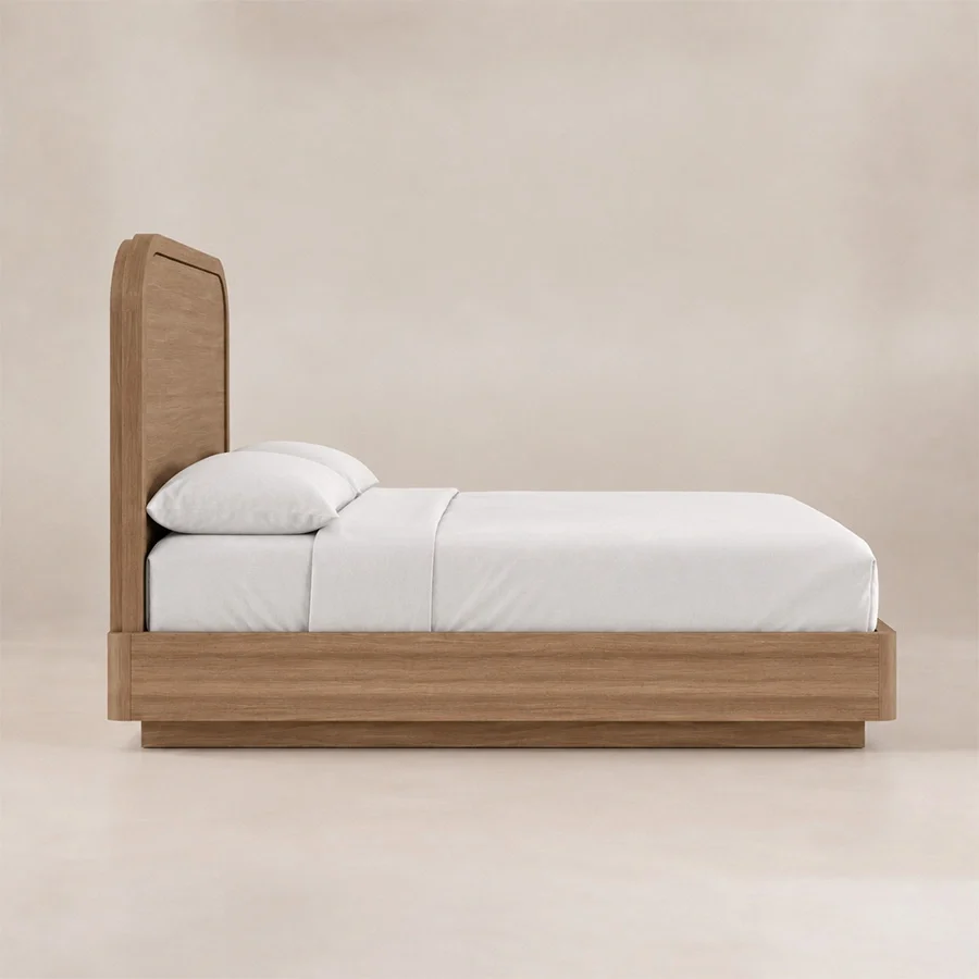 Side view of Soreven Archline Bed in Warm Walnut finish with arched headboard and low wooden frame.