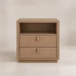 Front view of Soreven Archline matching bedside table in Warm Walnut finish with open shelf, two drawers, and brass handles.