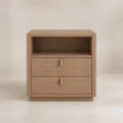 Front view of Soreven Archline matching bedside table in Warm Walnut finish with open shelf, two drawers, and brass handles.