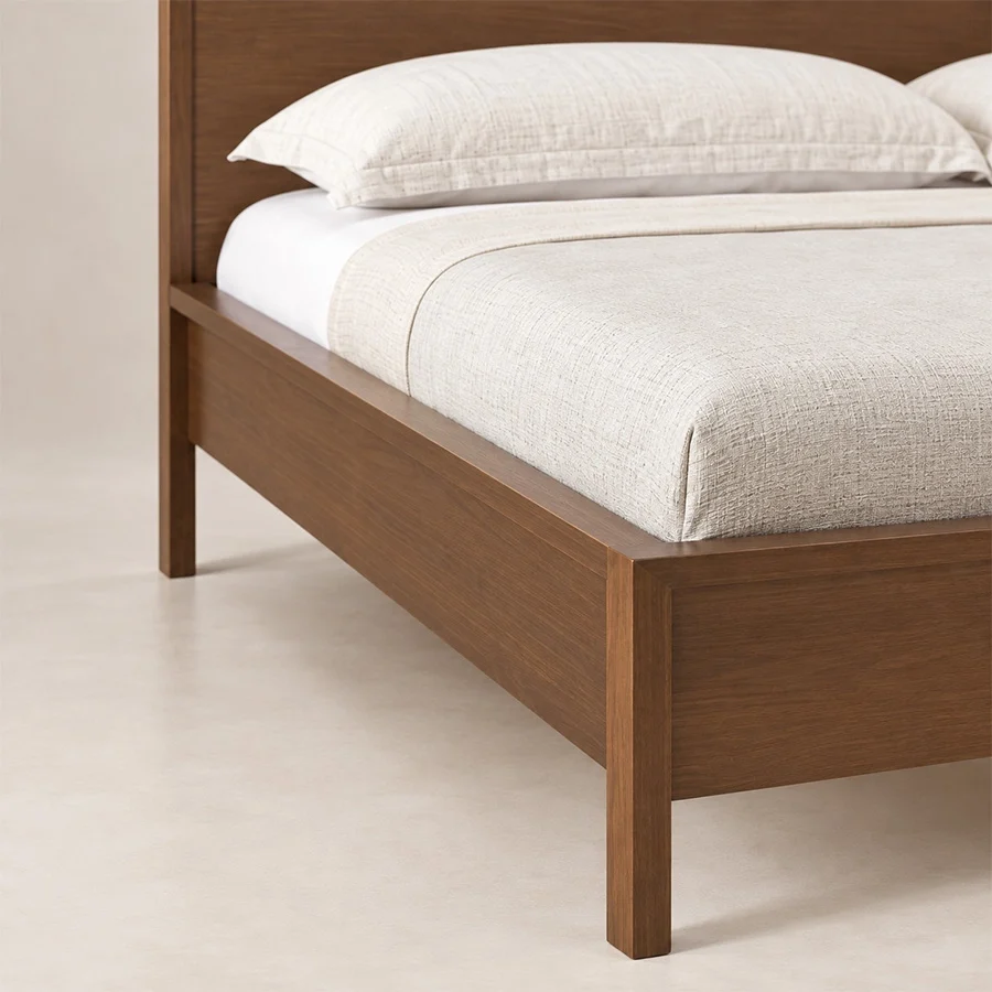 Tammy-bed-closeup-view Close-up of Kelden Linea Bed in Walnut Brown finish showing the wooden frame, side rail, and slim tapered leg.