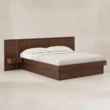 Angled view of modern wooden storage bed with panel headboard and integrated bedside shelf.