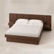 Angled top view of Veyran Wooden Storage Bed in Deep Brown finish with paneled headboard, integrated bedside tables, and under-bed storage.
