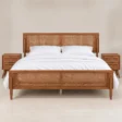 Maroven Grid Bed Set in warm wood finish with woven cane headboard, matching cane footboard, and two bedside tables.